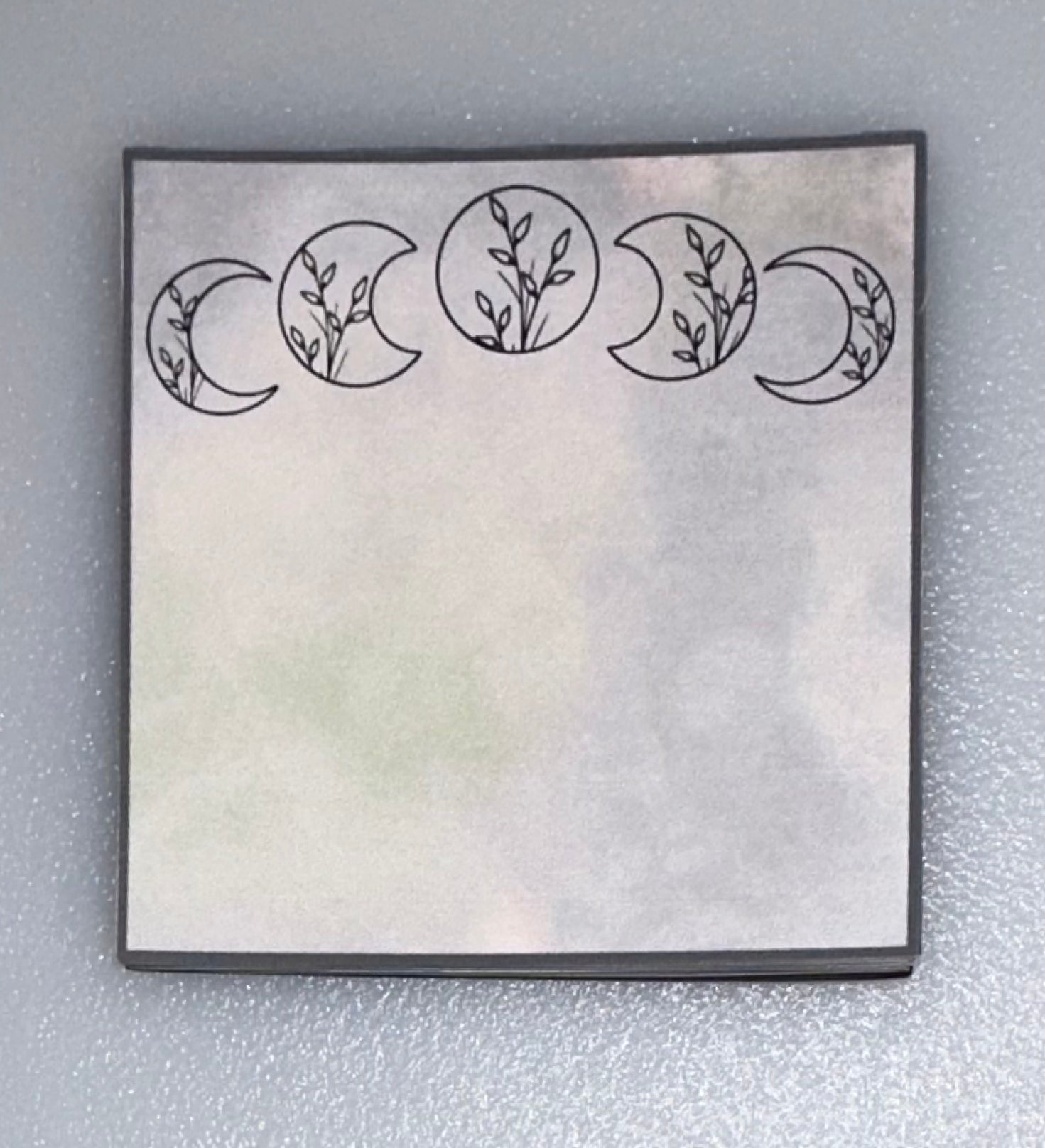 Matching mini notepad with crescent moons and leaves