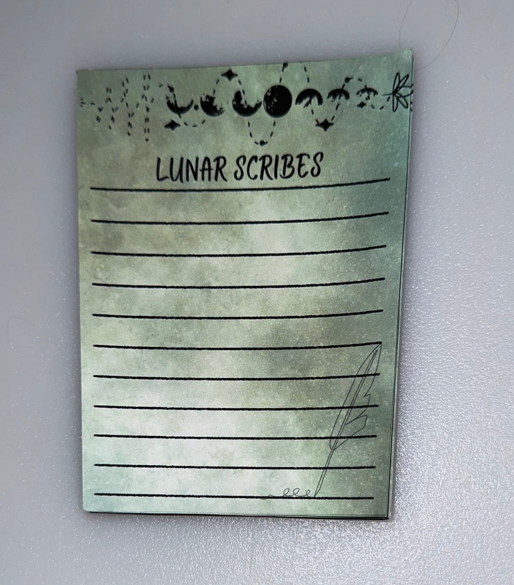 Lunar Scribes notepad with quill and moon pattern
