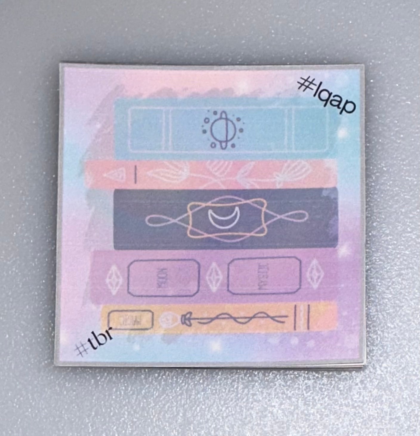 Mini Notes with stacked magical books — pastel rainbow and mystic theme